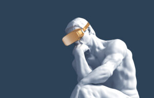 Thinker With Golden VR Glasses Over Blue Background.